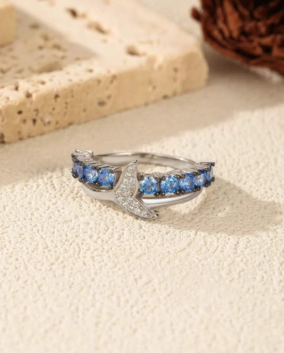 Walflossen Ring - blaue und klare Zirkonia auf gekreuztem Band, Größen 5 bis 9, 925 Sterlingsilber